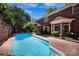 Spacious backyard features a sparkling pool, perfect for relaxing and entertaining guests at 7014 Walton Heath Ln, Charlotte, NC 28277