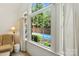 Main bedroom has a view of the backyard and sparkling pool at 7014 Walton Heath Ln, Charlotte, NC 28277