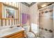 Functional bathroom features classic wallpaper, essential fixtures, and a convenient walk-in shower at 753 Briarfield Rd, Rock Hill, SC 29730