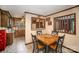 Charming dining area adjacent to kitchen with natural wood table set at 753 Briarfield Rd, Rock Hill, SC 29730