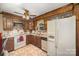 Classic kitchen features wooden cabinetry, durable tile flooring, and modern appliances for everyday convenience at 753 Briarfield Rd, Rock Hill, SC 29730