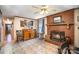Inviting living room featuring a cozy fireplace, tile floors, and a stylish wooden cabinet at 753 Briarfield Rd, Rock Hill, SC 29730