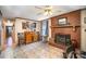 Inviting living room featuring a cozy fireplace, tile floors, and a stylish wooden cabinet at 753 Briarfield Rd, Rock Hill, SC 29730