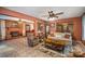 Inviting living room featuring a brick fireplace, tan sofa, and ceiling fan at 753 Briarfield Rd, Rock Hill, SC 29730