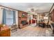 Spacious living room features a brick fireplace, tile floors, and seamless flow to the kitchen at 753 Briarfield Rd, Rock Hill, SC 29730