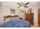 Comfortable main bedroom with a wooden bed frame, a ceiling fan and plenty of natural light at 753 Briarfield Rd, Rock Hill, SC 29730