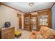 Sitting area features glass display cabinets for collectibles at 753 Briarfield Rd, Rock Hill, SC 29730
