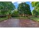 Outdoor deck overlooking a lush, green backyard with mature trees at 8000 Pelorus Ln, Charlotte, NC 28269