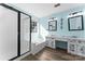 Bathroom featuring double vanity sinks, a large tub, and shower at 8000 Pelorus Ln, Charlotte, NC 28269