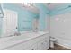 Bathroom featuring double sinks, large mirror, and shower/tub combo at 8000 Pelorus Ln, Charlotte, NC 28269