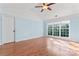 Bright bedroom with a large window and hardwood floors at 8000 Pelorus Ln, Charlotte, NC 28269