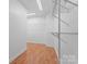 Walk-in closet with shelving offers storage space and organizational options at 8000 Pelorus Ln, Charlotte, NC 28269