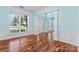 Inviting foyer with hardwood floors, white trim, and a grand window showcasing the front yard at 8000 Pelorus Ln, Charlotte, NC 28269