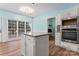 Bright kitchen features an island, granite counters, stainless steel appliances, and white cabinetry at 8000 Pelorus Ln, Charlotte, NC 28269