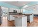 Kitchen featuring an island, granite counters, white cabinets, and stainless steel appliances at 8000 Pelorus Ln, Charlotte, NC 28269