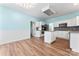 Spacious kitchen features an island, stainless steel appliances, granite counters, and white cabinets at 8000 Pelorus Ln, Charlotte, NC 28269