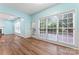 Spacious living room with large window and access to the deck at 8000 Pelorus Ln, Charlotte, NC 28269