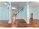 Open-concept living room showcasing elegant pillars and gleaming hardwood floors at 8000 Pelorus Ln, Charlotte, NC 28269