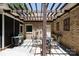 Brick patio features a table, seating, and grill under a pergola at 804 Creek Bluff Rd, Rock Hill, SC 29732