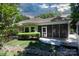 A screened porch and landscaped backyard provide an outdoor oasis at 804 Creek Bluff Rd, Rock Hill, SC 29732