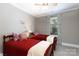 Cozy bedroom with twin beds, a ceiling fan, plush carpet, and window letting in plenty of natural light at 804 Creek Bluff Rd, Rock Hill, SC 29732