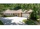 Beautiful home exterior featuring brick, stone, swing, and a spacious driveway, perfect for a Gathering at 804 Creek Bluff Rd, Rock Hill, SC 29732
