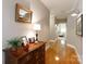 Elegant hallway with wood floors, decorative lighting, and a glimpse into the living area at 804 Creek Bluff Rd, Rock Hill, SC 29732
