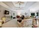 Comfortable living room with a tray ceiling, soft lighting, and a seamless flow to other spaces at 804 Creek Bluff Rd, Rock Hill, SC 29732