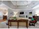 Inviting living room with tray ceiling, ceiling fans, and a seamless flow to dining room at 804 Creek Bluff Rd, Rock Hill, SC 29732