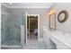 An open main bathroom with tile flooring and shower, marble countertops and a large vintage mirror at 804 Creek Bluff Rd, Rock Hill, SC 29732