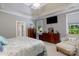 Spacious main bedroom with a tray ceiling, plush carpet, a sitting area and dark wood furniture at 804 Creek Bluff Rd, Rock Hill, SC 29732