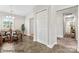 Dining area leading to the hallway and kitchen, plus a large double door closet at 8724 Tweedsmuir Glen Ln, Charlotte, NC 28215