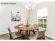 Bright dining area features natural light, seating for four, and modern decor at 8724 Tweedsmuir Glen Ln, Charlotte, NC 28215