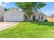 Charming single-Gathering home with a well-manicured lawn and attached two-car garage at 8724 Tweedsmuir Glen Ln, Charlotte, NC 28215
