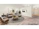 Open living room with plush carpet, recessed lighting, and view of the kitchen at 8724 Tweedsmuir Glen Ln, Charlotte, NC 28215