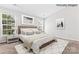 Relaxing main bedroom with natural light, stylish décor, and a calm, neutral color palette at 8724 Tweedsmuir Glen Ln, Charlotte, NC 28215