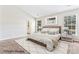 Inviting main bedroom with a large window, ensuite bathroom, and neutral décor at 8724 Tweedsmuir Glen Ln, Charlotte, NC 28215