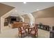 Cozy bonus room featuring a seating area, game table, and built-in storage cabinets at 9110 Woodhall Lake Dr, Waxhaw, NC 28173