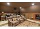 Private home theater featuring leather reclining seats, projector, and ambient lighting at 9110 Woodhall Lake Dr, Waxhaw, NC 28173