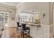 View of the kitchen showing breakfast bar, countertop, and hardwood flooring at 9110 Woodhall Lake Dr, Waxhaw, NC 28173