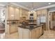 Kitchen showcases custom cabinets, granite countertops, a large island, and stainless steel appliances at 9110 Woodhall Lake Dr, Waxhaw, NC 28173