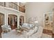Spacious living room with a high ceiling, balcony overlook, and elegant furnishings at 9110 Woodhall Lake Dr, Waxhaw, NC 28173