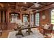 Sophisticated home office featuring custom wood paneling, built-in shelving, and a large desk at 9110 Woodhall Lake Dr, Waxhaw, NC 28173