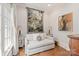 Cozy sitting room featuring a comfortable sofa, side tables, and natural lighting at 9110 Woodhall Lake Dr, Waxhaw, NC 28173