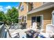 Inviting back deck with a grill, outdoor seating, and a fire pit, perfect for relaxing and entertaining at 10104 Treetop Ln, Cornelius, NC 28031