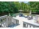 Multi-level outdoor deck featuring dining and lounging areas at 10104 Treetop Ln, Cornelius, NC 28031