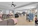 Bright open living room with tile floors, modern lighting, and ample seating options at 10104 Treetop Ln, Cornelius, NC 28031