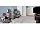 Home office with neutral carpet, desk, monitors and chair for productive work at 10104 Treetop Ln, Cornelius, NC 28031