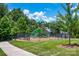 Community playground with modern play equipment, offering a fun and safe environment for children to play at 10104 Treetop Ln, Cornelius, NC 28031