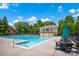 Large community swimming pool with lounge chairs and tables, ideal for relaxation and social gatherings at 10104 Treetop Ln, Cornelius, NC 28031